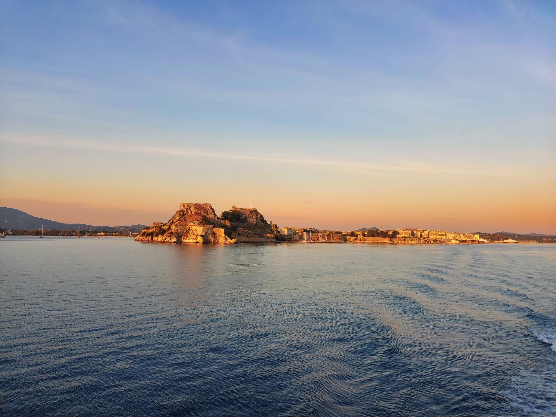 Corfu Old Fortress at sunset from the sea
